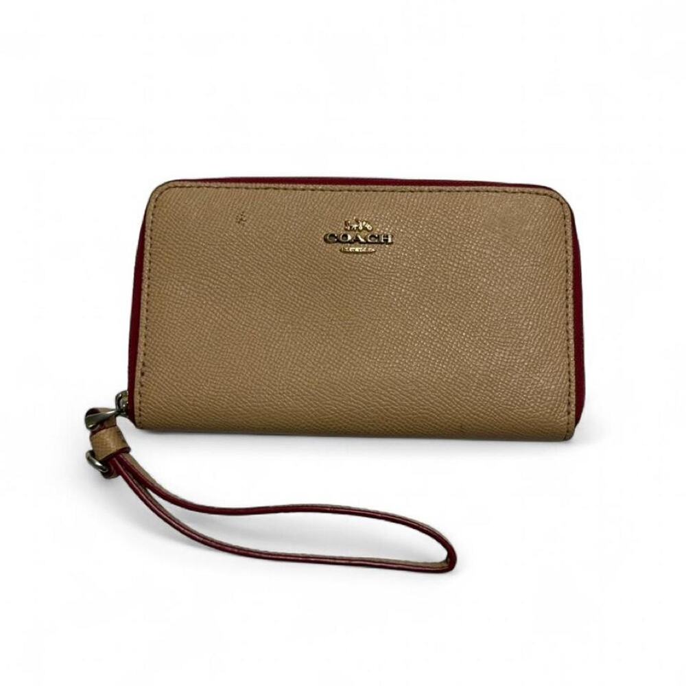 Coach small tan and red leather  wallet with wrist strap gold hardware
